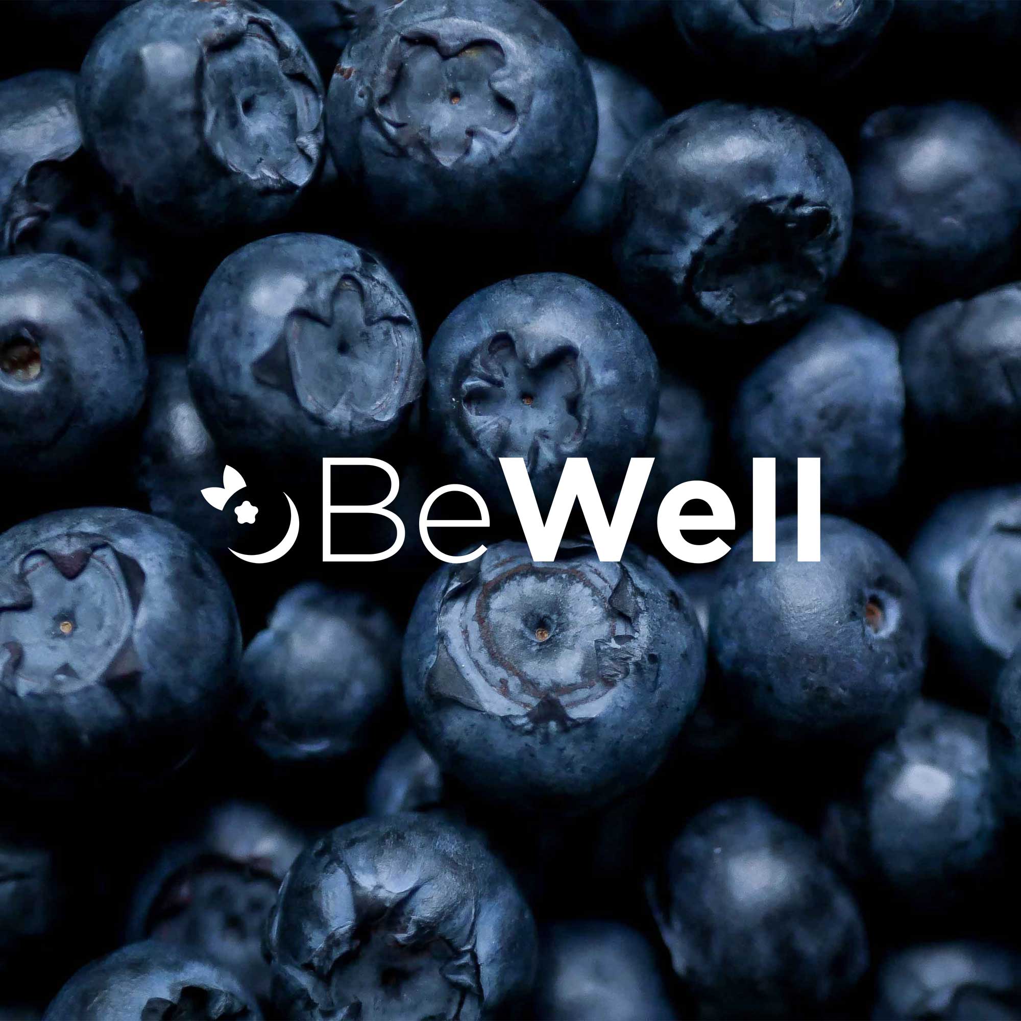 BeWell Logo over blueberries